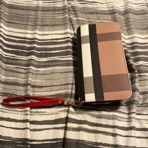 Wristlet strap is included